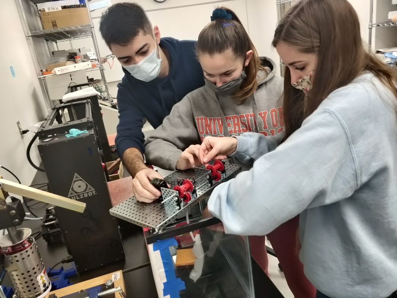 Student working with syringe and test tube in lab